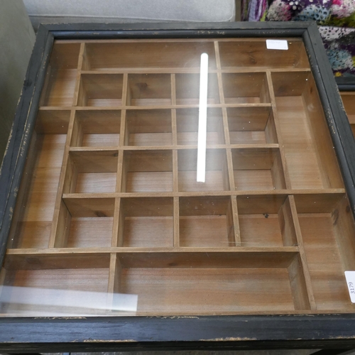 3179 - A black painted pine glass topped collectors cabinet nest of tables