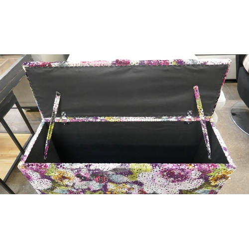 3180 - A multi-coloured textured velvet upholstered flower patterned storage ottoman