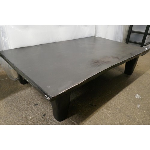 3141 - A large black painted timber rustic coffee table