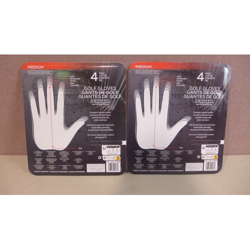 6135 - Two packs of Four medium Kirkland Signature golf gloves (345-736) *This lot is subject to Vat