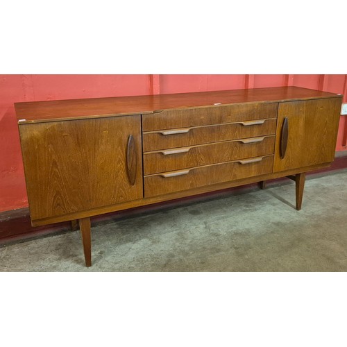 6 - A teak sideboard