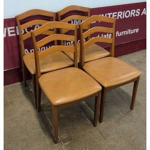 10 - A Nathan teak drop leaf table and four chairs