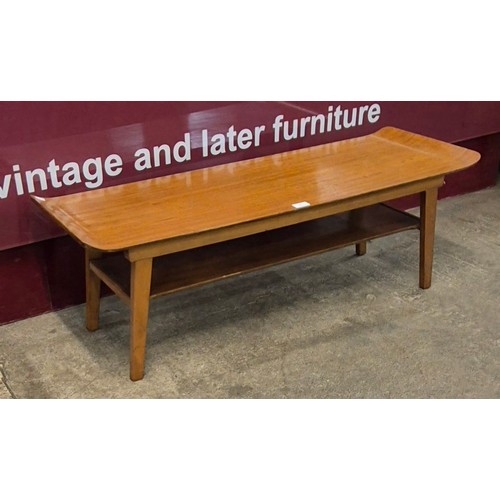 11 - A Myer teak rectangular sleigh top table