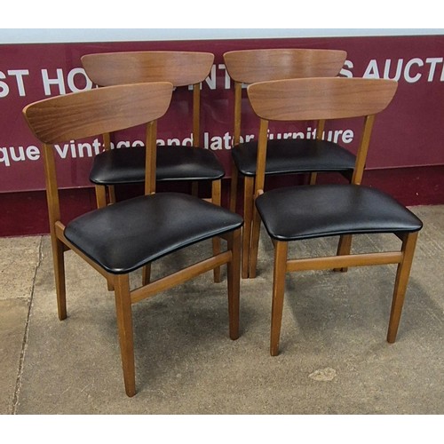 14 - A teak drop leaf table and four chairs