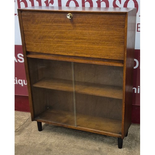 21 - A Herbert Gibbs tola wood writing cabinet/bookcase