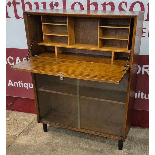 21 - A Herbert Gibbs tola wood writing cabinet/bookcase