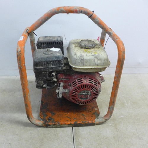 5021 - A Belle 4HP petrol driven poker power unit with a Honda GX120 4.0 petrol engine