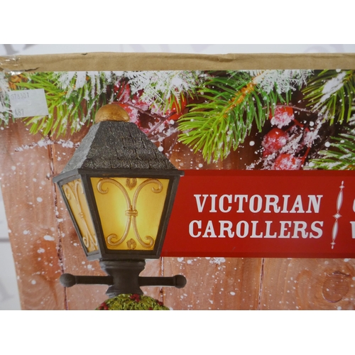 5183 - A battery operated light up Christmas decoration - Victorian carollers