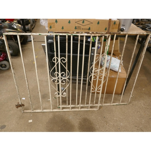 5207 - A pair of white painted wrought iron drive way gates