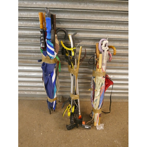 5209 - A large quantity of assorted umbrellas and a quantity of litter pickers