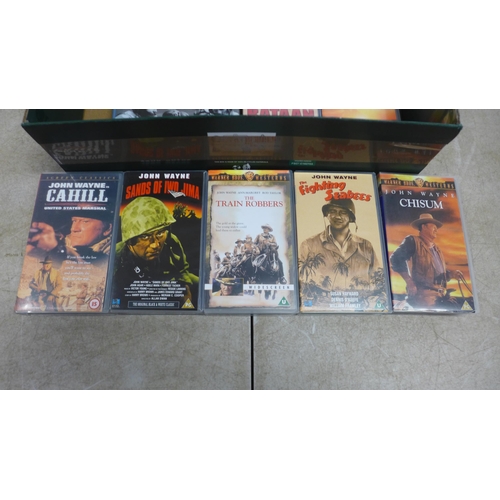 5052 - A collection of VHS cassettes including John Wayne, The Train Robbers, Hell Fighters, etc. and The S... 