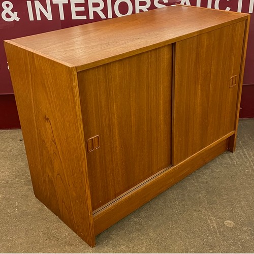 40 - A Swedish teak sliding door cabinet