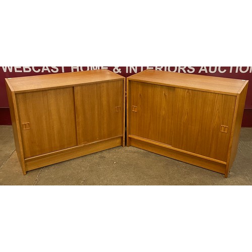 41 - A pair of Swedish teak sliding door cabinets