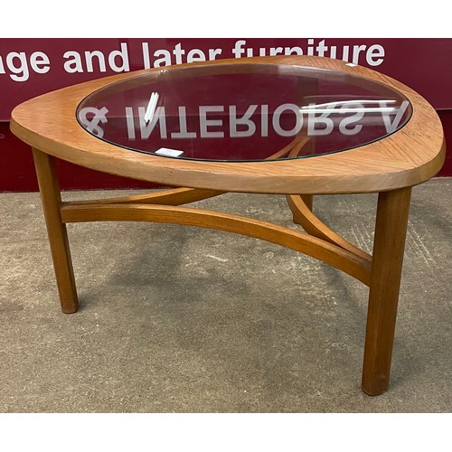 45 - A Nathan teak and glass topped triangular coffee table