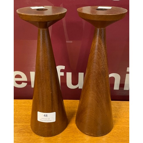 48 - A pair of Anri Form teak candleholders