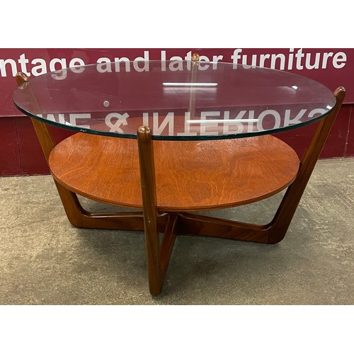 53 - A Lebus teak and glass topped circular coffee table