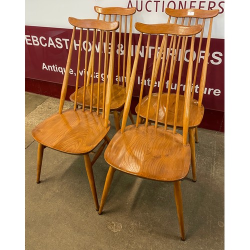 60 - A set of four Ercol Blonde elm and beech Goldsmith chairs