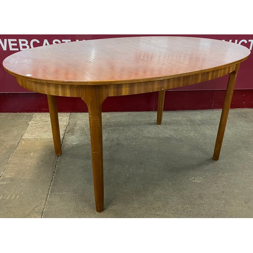 71 - A McIntosh teak oval extending dining table