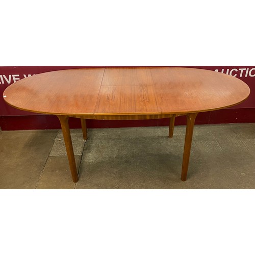 71 - A McIntosh teak oval extending dining table