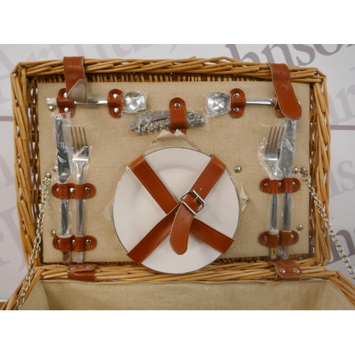 5214 - A wicker picnic basket including cutlery set