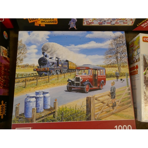 5227 - A large quantity of jigsaw puzzles