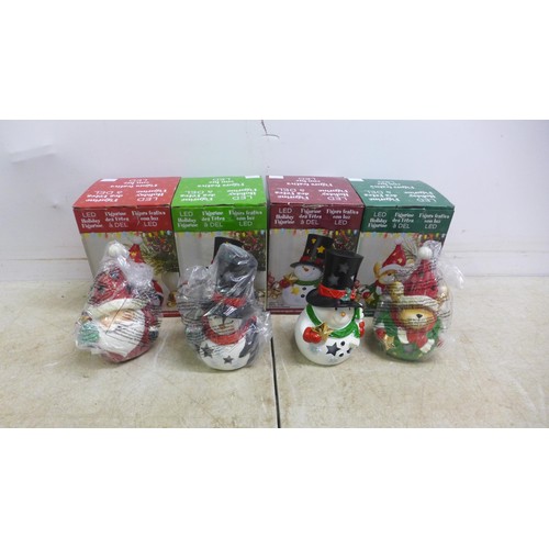 5048J - Four LED holiday figurines in boxes including Santa, Snowman, etc