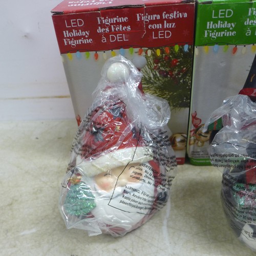 5048J - Four LED holiday figurines in boxes including Santa, Snowman, etc