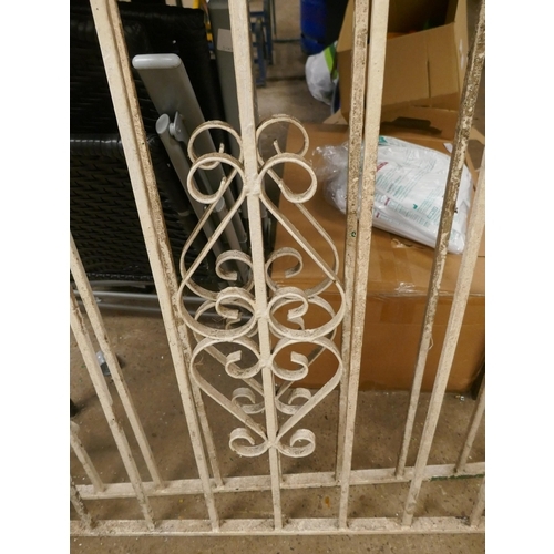 5207 - A pair of white painted wrought iron drive way gates