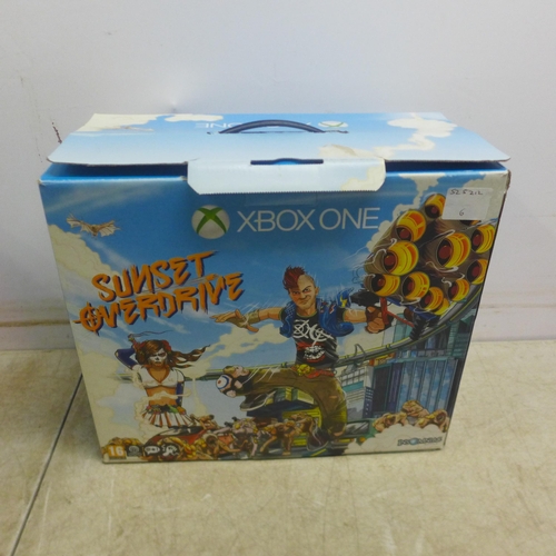 5059 - An Xbox 360 console with a Sunset Overdrive special edition Xbox One box