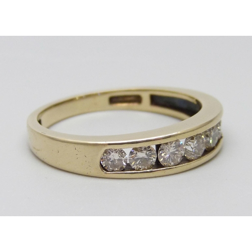 7004 - A 9ct gold seven stone diamond half-eternity ring, diamond weight 0.75 carats, stamped to band, Q, 3... 