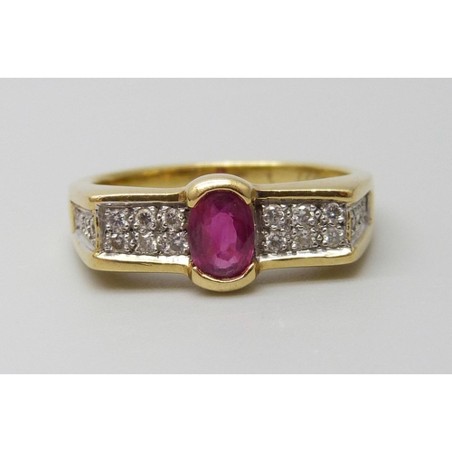 7012 - An 18ct gold ring set with a central ruby and diamonds, 5.5g, N/O