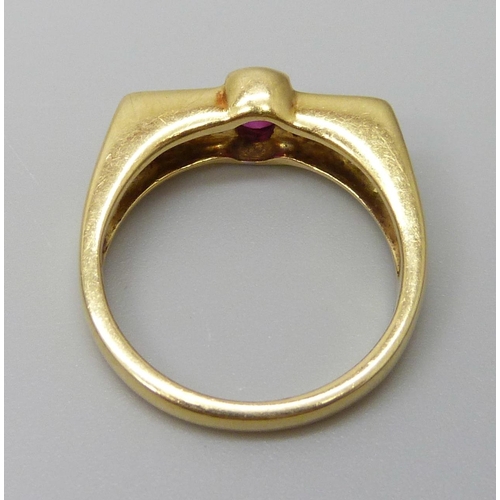 7012 - An 18ct gold ring set with a central ruby and diamonds, 5.5g, N/O