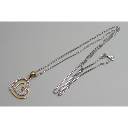 7025 - A 9ct gold and diamond set pendant on a fine 9ct white gold chain, 5.2g, chain 50cm