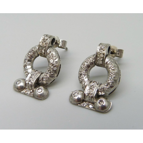 7026 - A pair of Art Deco white metal set diamond earrings, with box