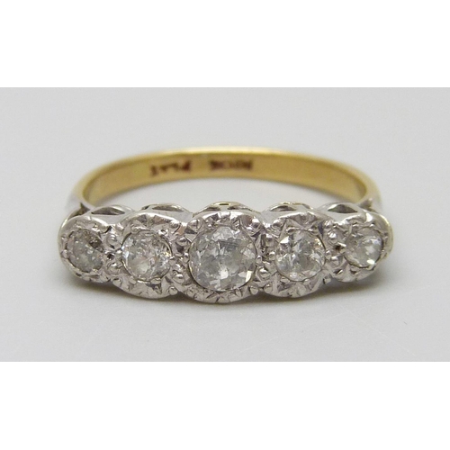 7028 - An 18ct gold, platinum set five stone diamond ring, 3.5g, L/M