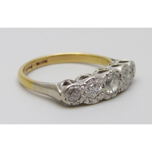 7028 - An 18ct gold, platinum set five stone diamond ring, 3.5g, L/M