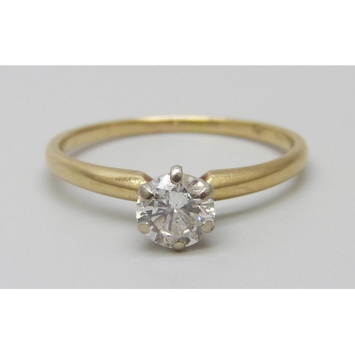 7033 - A yellow metal set diamond solitaire ring, approximately 0.70ct diamond weight, 1.8g, P