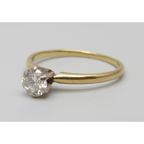 7033 - A yellow metal set diamond solitaire ring, approximately 0.70ct diamond weight, 1.8g, P