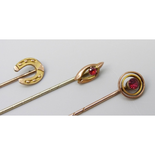 7035 - Three 9ct gold stick pins, 2.6g, one with metal pin