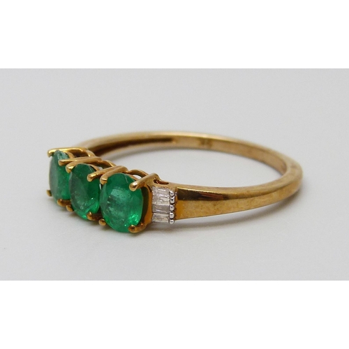 7042 - A 9ct gold, diamond and emerald ring, 1.9g, Q