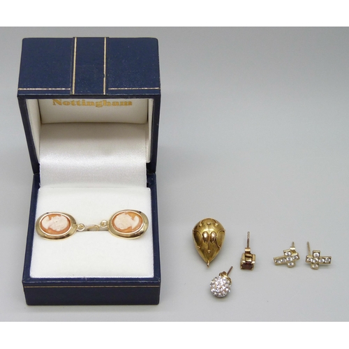 7043 - A pair of 9ct gold cameo earrings, a pair of 9ct gold cross earrings, two 9ct gold single earrings a... 