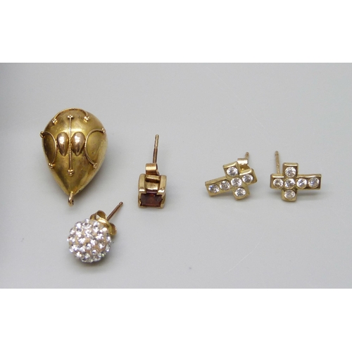 7043 - A pair of 9ct gold cameo earrings, a pair of 9ct gold cross earrings, two 9ct gold single earrings a... 