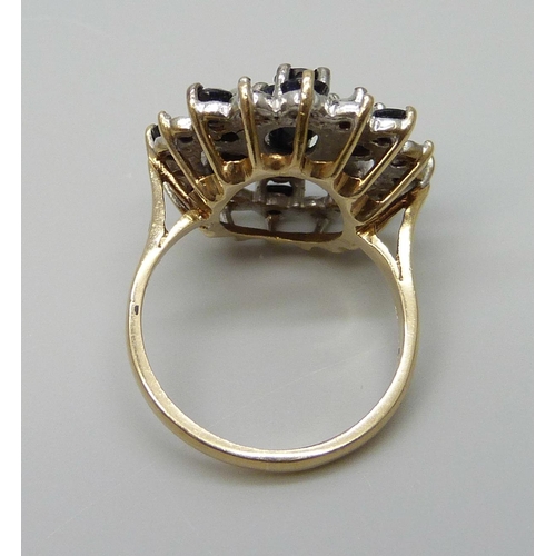 7048 - A vintage 9ct gold sapphire and diamond cluster ring, Birmingham 1987, J½, 4.9g