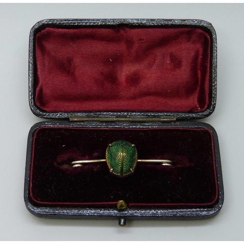 7050 - An antique scarab beetle brooch in vintage box