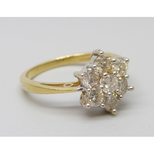 7055 - An 18ct gold seven stone diamond cluster ring, estimated total weight 0.80 carat, M, 3.7g