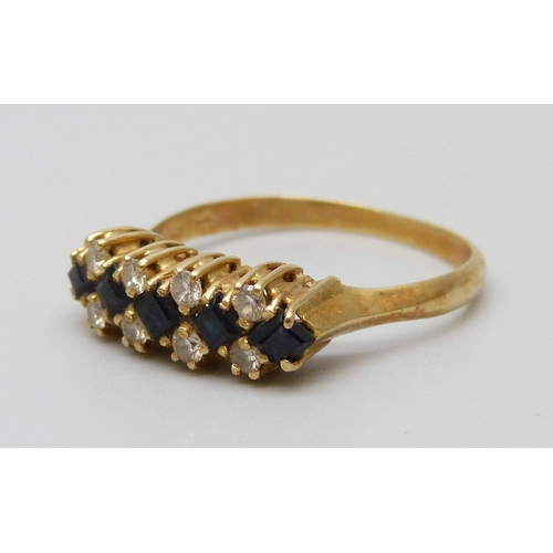 7056 - A yellow metal, sapphire and diamond ring, 2.6g, M