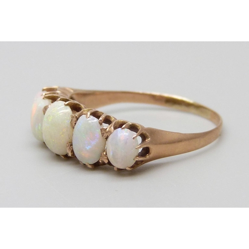 7079 - A yellow metal and five stone opal ring, 1.8g, L