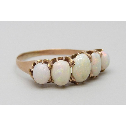 7079 - A yellow metal and five stone opal ring, 1.8g, L