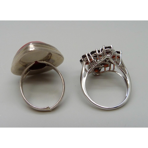 7083 - Two 925 sterling silver statement rings, one set with a 12.97ct coral and one set with 5.00ct garnet... 