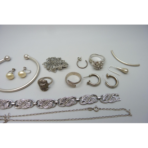 7091 - A collection of silver and other jewellery, torque bangle, rings, etc.